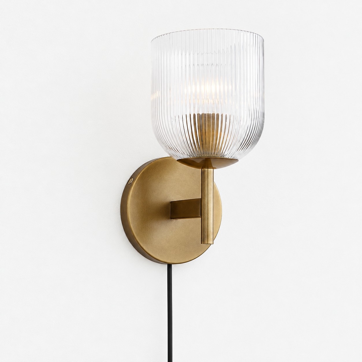 Tumbled brass ribbed-glass wall sconce, one light